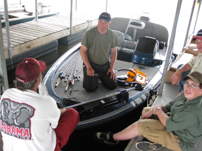 John (Bamabassman), Mark (Woody), Anthony (BigBassin144), and Jeff (Kingfish) working on replacing Mark's burned out trolling motor.